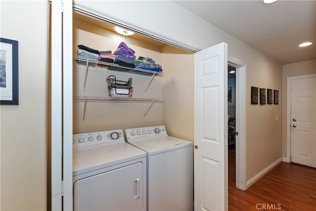 laundry room with independent washer and dryer, laundry area, recessed lighting, baseboards, and wood finished floors