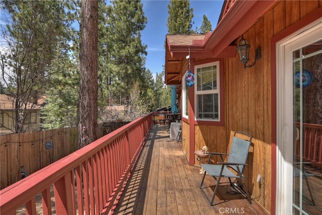 wooden deck featuring fence