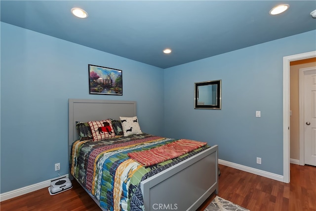 bedroom with baseboards, recessed lighting, and wood finished floors