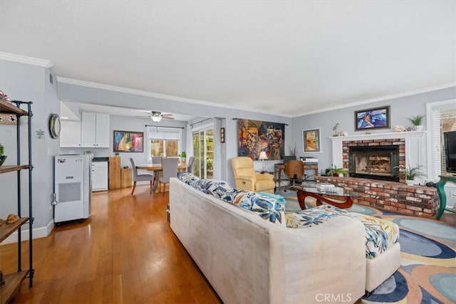 1585 Saratoga Ave, Grover Beach, CA 93433 - living area featuring ornamental molding, wood finished floors, ceiling fan, and a fireplace