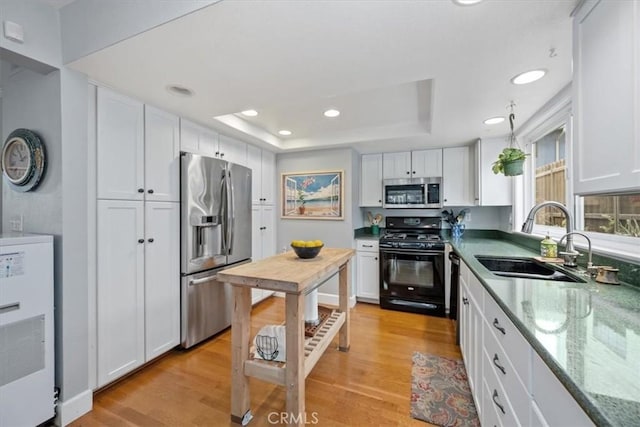 1585 Saratoga Ave, Grover Beach, CA 93433 - kitchen featuring stainless steel appliances, a sink, white cabinetry, light wood-style flooring, and recessed lighting