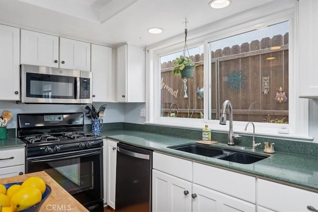 1585 Saratoga Ave, Grover Beach, CA 93433 - kitchen featuring stainless steel microwave, black range with gas cooktop, dishwasher, a sink, and white cabinetry