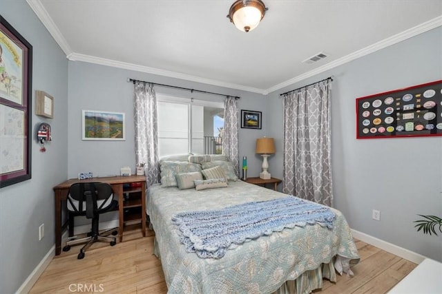 1585 Saratoga Ave, Grover Beach, CA 93433 - bedroom featuring wood finished floors, crown molding, baseboards, and a desk