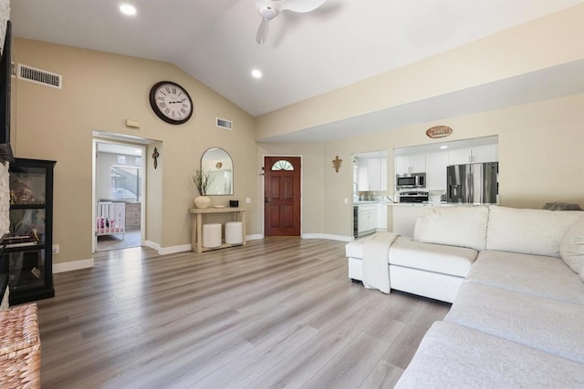 living area with light wood-style floors, a ceiling fan, baseboards, recessed lighting, and visible vents