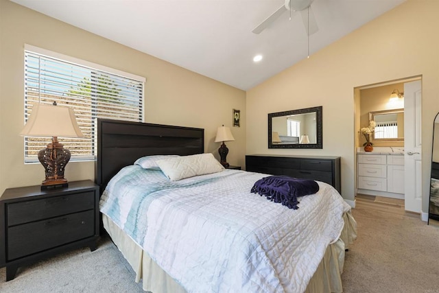 bedroom with light carpet, ensuite bathroom, recessed lighting, a ceiling fan, and vaulted ceiling
