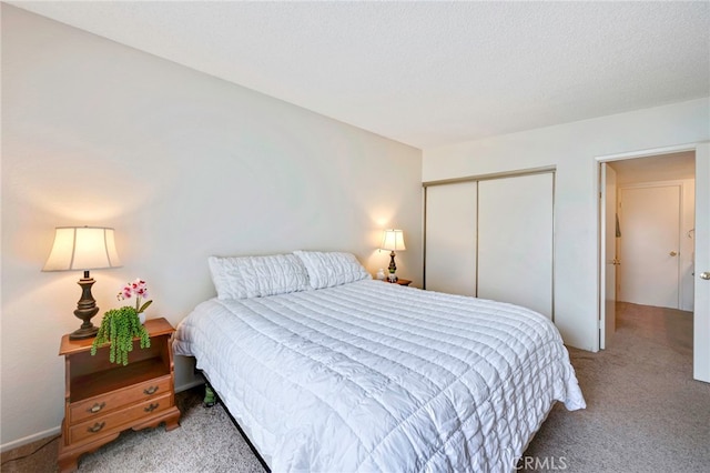 carpeted bedroom with a closet