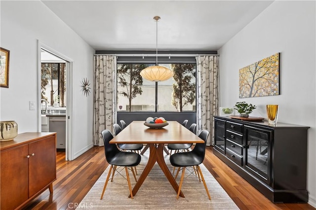 dining room with wood finished floors