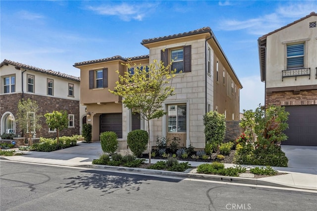 1776 Canyon Oaks Ln, Lake Forest, CA 92610 - mediterranean / spanish-style home featuring an attached garage, concrete driveway, stucco siding, and a tiled roof