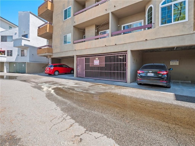 4301 Fulton Ave Unit 303, Sherman Oaks, CA 91423 - view of building exterior featuring covered parking