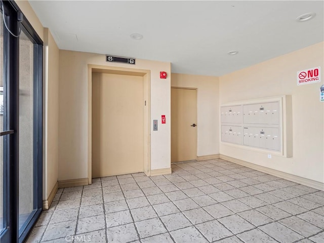 4301 Fulton Ave Unit 303, Sherman Oaks, CA 91423 - unfurnished room featuring mail area, baseboards, elevator, light tile patterned floors, and recessed lighting