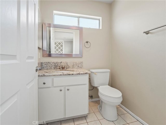4301 Fulton Ave Unit 303, Sherman Oaks, CA 91423 - bathroom featuring toilet, vanity, tile patterned flooring, and baseboards