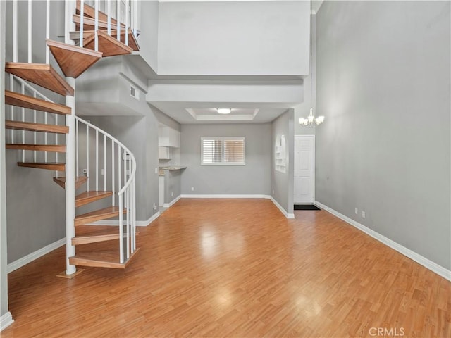 4301 Fulton Ave Unit 303, Sherman Oaks, CA 91423 - foyer entrance featuring light wood-style flooring, stairway, and baseboards