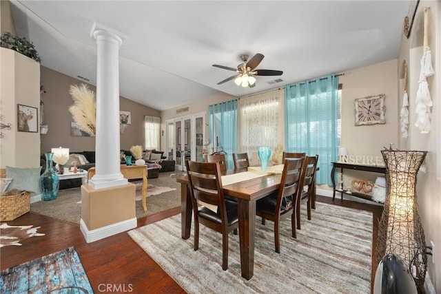 dining area with french doors, a ceiling fan, decorative columns, visible vents, and wood finished floors