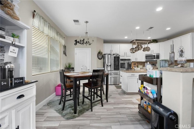 dining space with recessed lighting, baseboards, visible vents, and light wood-type flooring