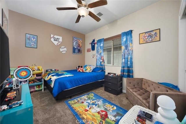 carpeted bedroom featuring ceiling fan and visible vents
