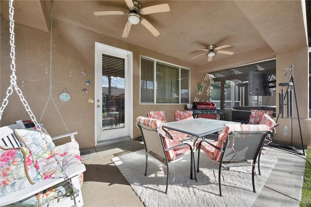 view of patio featuring a ceiling fan and outdoor dining space