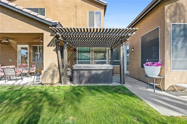 exterior space featuring a patio, ceiling fan, a hot tub, and a pergola