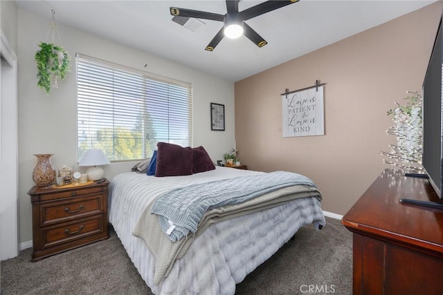 carpeted bedroom with baseboards, ceiling fan, and visible vents