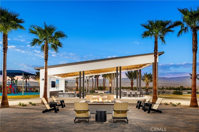 75175 Tubman St, Palm Desert, CA 92211 - surrounding community featuring a mountain view, playground community, and an outdoor fire pit