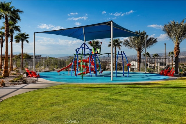 75175 Tubman St, Palm Desert, CA 92211 - communal playground with fence and a lawn