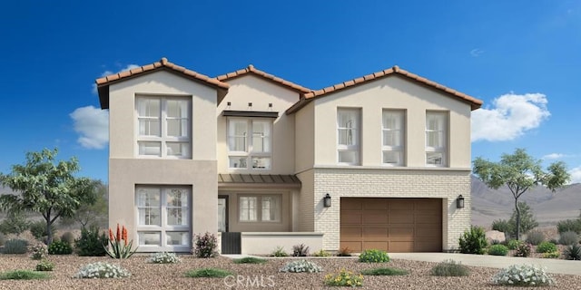 75175 Tubman St, Palm Desert, CA 92211 - mediterranean / spanish house with concrete driveway, brick siding, an attached garage, and stucco siding