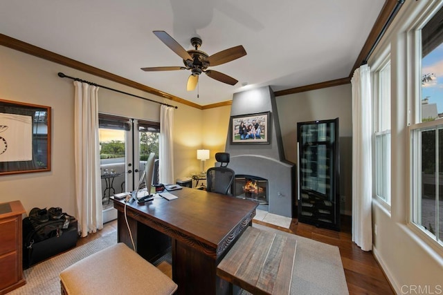 home office with crown molding, wood finished floors, baseboards, beverage cooler, and ceiling fan