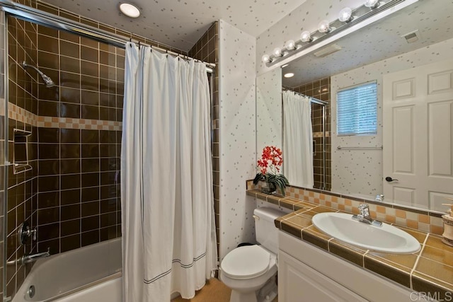 bathroom featuring vanity, toilet, decorative backsplash, and shower / tub combo with curtain