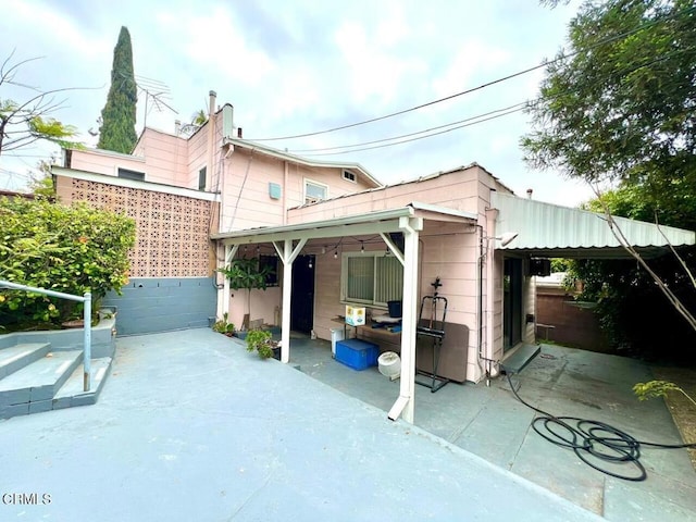 rear view of house featuring a patio
