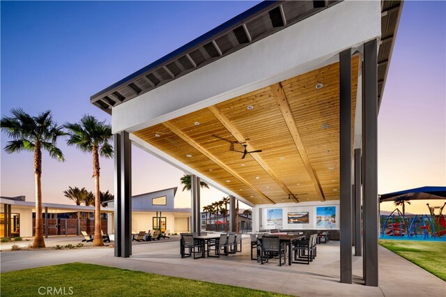 view of patio with ceiling fan and outdoor dining area