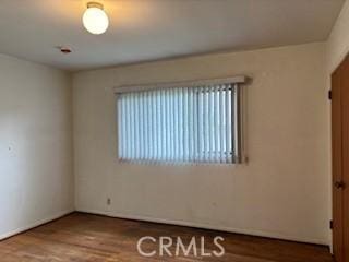 unfurnished room featuring wood finished floors