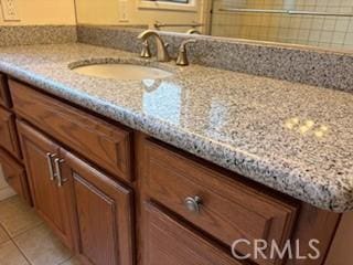 bathroom featuring tile patterned floors and vanity