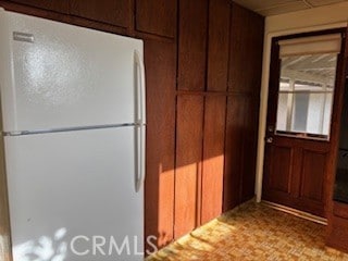 kitchen featuring freestanding refrigerator