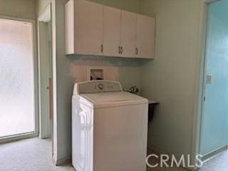 laundry room with washer / dryer and cabinet space