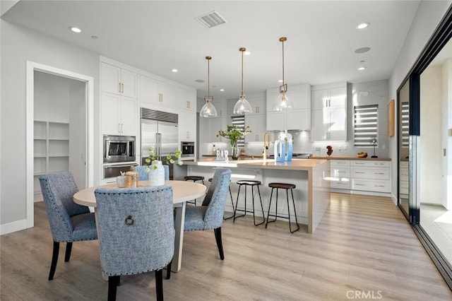 20526 W Overlook Ct, Porter Ranch, CA 91326 - dining space with light wood-style floors and recessed lighting