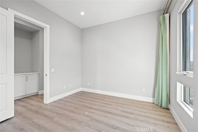 20526 W Overlook Ct, Porter Ranch, CA 91326 - unfurnished bedroom featuring light wood-type flooring, baseboards, recessed lighting, and multiple windows
