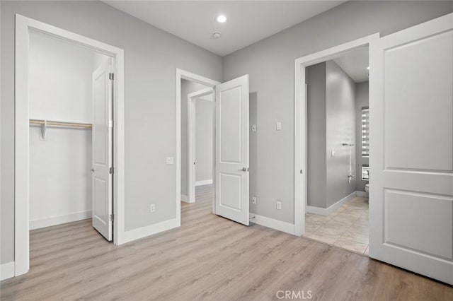 20526 W Overlook Ct, Porter Ranch, CA 91326 - unfurnished bedroom with wood finished floors, a closet, and baseboards