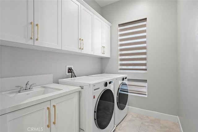 20526 W Overlook Ct, Porter Ranch, CA 91326 - clothes washing area with cabinet space, washer and dryer, and baseboards