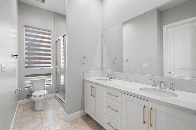 20526 W Overlook Ct, Porter Ranch, CA 91326 - bathroom featuring toilet, a stall shower, baseboards, and double vanity
