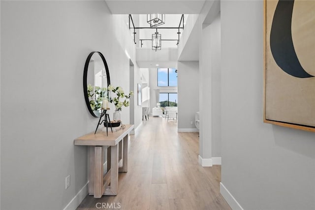 20526 W Overlook Ct, Porter Ranch, CA 91326 - corridor with wood finished floors, baseboards, and a high ceiling