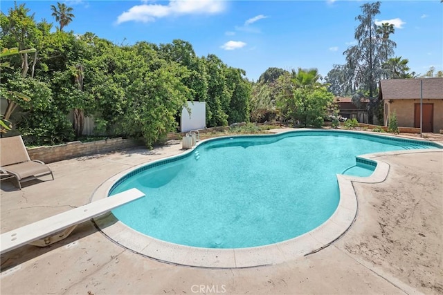view of swimming pool featuring a fenced backyard, a fenced in pool, and a patio