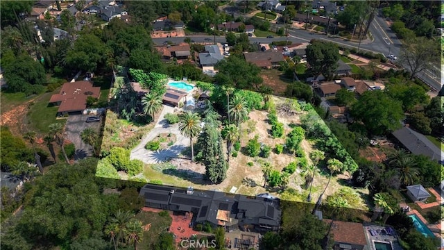 birds eye view of property with a residential view