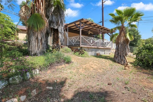 view of yard with covered porch