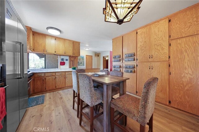 120 Franklin Ave, Redlands, CA 92373 - dining area with light wood-type flooring and a chandelier