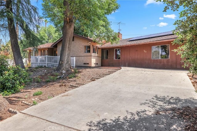 120 Franklin Ave, Redlands, CA 92373 - view of front of property featuring solar panels, a chimney, and driveway