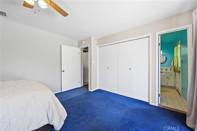 unfurnished bedroom with a ceiling fan, visible vents, carpet floors, a closet, and ensuite bathroom