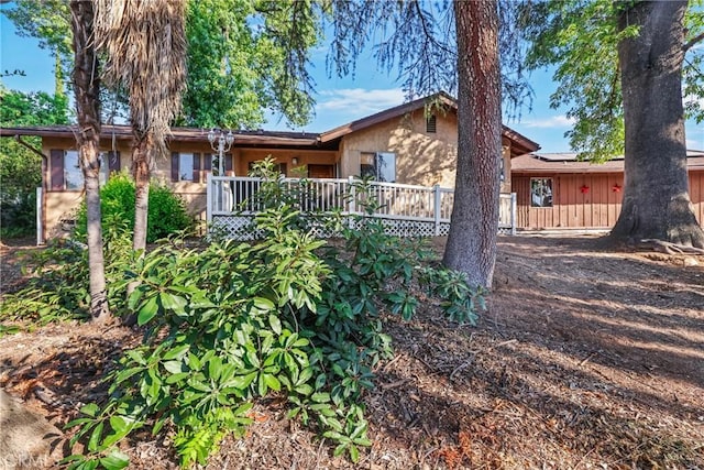 120 Franklin Ave, Redlands, CA 92373 - view of front facade featuring roof mounted solar panels and a deck