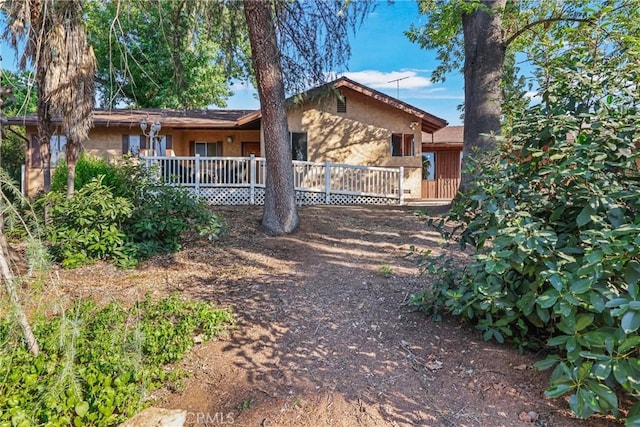 120 Franklin Ave, Redlands, CA 92373 - view of front of house with stucco siding and a deck