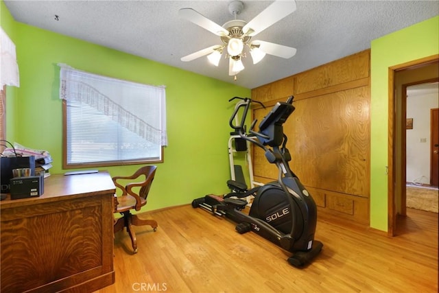 120 Franklin Ave, Redlands, CA 92373 - exercise room with wood finished floors, a ceiling fan, and a textured ceiling