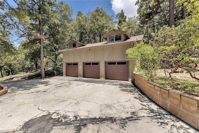 garage with aphalt driveway