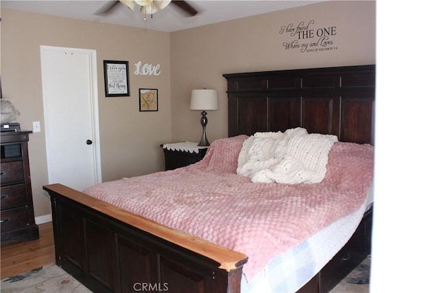 bedroom with ceiling fan and light wood finished floors